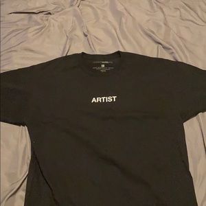 Black fashion nova shirt with artist writing on it